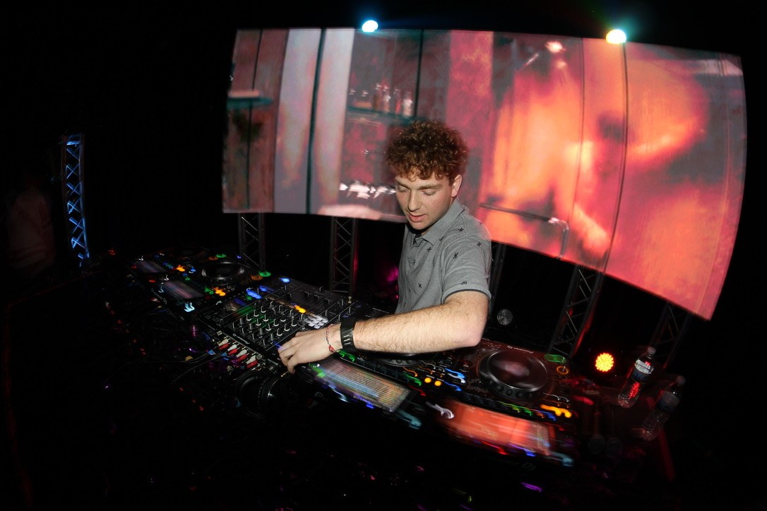 BENGAL performing behind Pioneer decks in front of a glowing LED wall